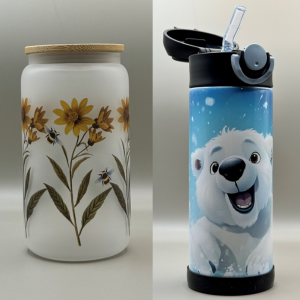 A frosted white cup with painted on sunflowers and a metal water bottle that is blue with a white polar bear