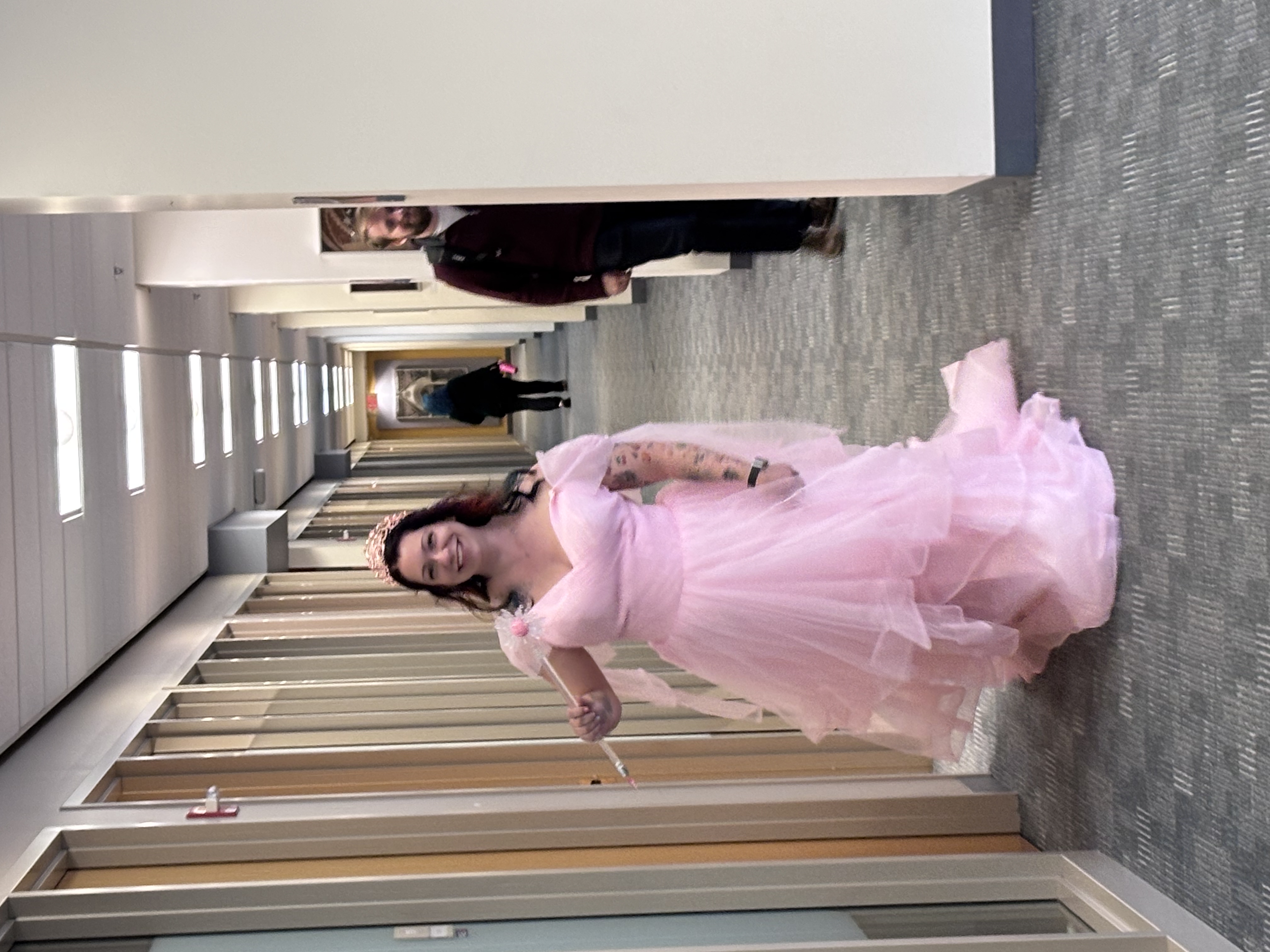 Employee dressed as Glinda the Good Witch
