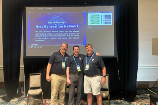 The 3 NGN presenters at Cisco Live standing on the stage