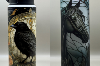 A metal water bottle with a raven on the front and a tall tumbler with a black horse on the front