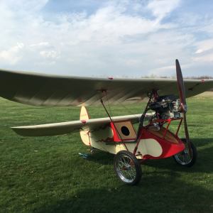 A small red and white aircraft that Jim built and flew